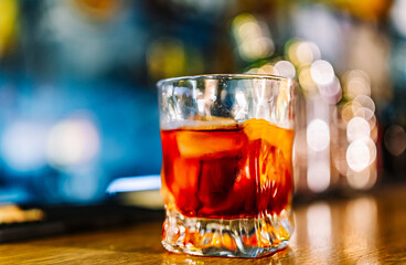 Cocktail Negroni with gin, campari martini rosso and orange. negroni cocktail at the bar