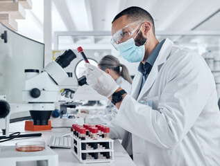 Aufkleber - Scientist doing research for covid using a microscope and test tube in a lab. Healthcare worker in biotechnology, medicine and analytics testing liquid in science laboratory for blood sample results