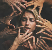Many Hands, Face And Abuse With A Woman Victim Feeling Fear, Alone Or Crying In Studio On A Dark Background. Sad, Pain And Violence With A Scared Female Suffering With Stress Or Social Anxiety