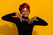 Photo of charming positive person toothy smile wear ethiopia national outfit isolated on yellow color background
