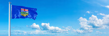 Alberta - State Of Canada, Flag Waving On A Blue Sky In Beautiful Clouds - Horizontal Banner
