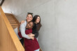 © Srdjan - Three young business woman freelancers celebrating on the stairs agreement they signed after they win the trial on the court for copyright infringement. Happy females had victory for stolen patent.