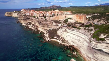 Wall Mural - Bonifacio - splendid coastal town in south of Corsica island, aerial drone video of houses hanging over rocks. France