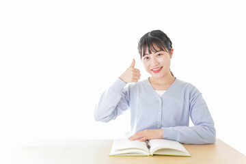 Poster - 勉強をしながら指を指す若い女子学生