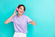 © deagreez - Photo of funky positive good mood woman with bob hairstyle dressed striped t-shirt dancing on party isolated on teal color background