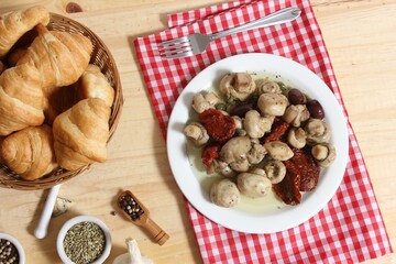 Wall Mural - Mushrooms, Sun Dried Tomato, Olives and Capers in Olive Oil on rustic table