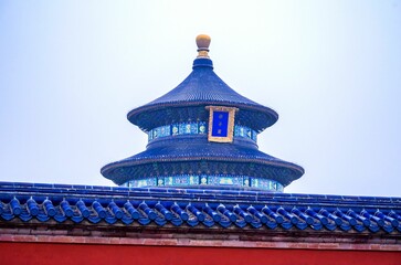 Top of an Asian architecture against blue sky on a sunny day