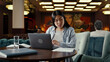 © Framestock - Asian businesswoman using laptop, working online on startup project, business strategy, analyzing papers and documents in office cafe. Worker of e-commerce marketing company