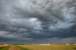 Stormy sky over the countryside. These dramatic clouds are known in meteorology as altocumulus asperitas.