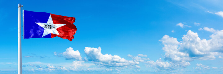 Wall Mural - San Antonio - USA, flag waving on a blue sky in beautiful clouds - Horizontal banner