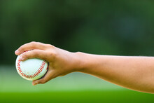 Close-up Of Person Holding Baseball Hand Closed On Ball In Central Florida