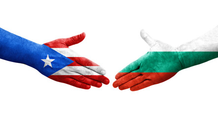 Wall Mural - Handshake between Bulgaria and Puerto Rico flags painted on hands, isolated transparent image.