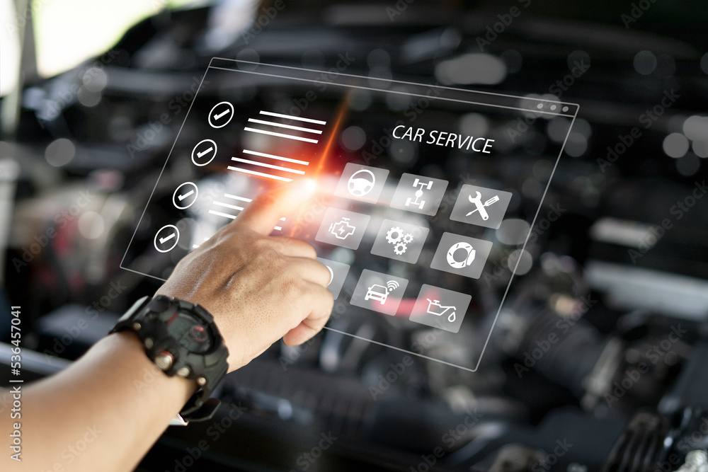 Car service on virtual screens concept, Service staff pointing on smart ...