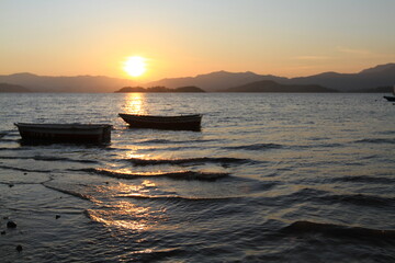 Wall Mural - a Sunset on a rocky beach in Hong Kong.