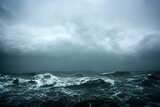 sea wave during storm in the ocean with big clouds and rain.