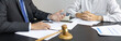 © Puwasit Inyavileart - Attorney or judge provides legal advice to the client in the courtroom, Ethics in the courts include justice and impartiality, Legal consultant, Scales of justice, Law hammer, Litigation and justice.