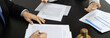 © Puwasit Inyavileart - Client describes the money fraud problem and discusses the solution with a lawyer in the litigation room, Ethics in the courts include justice, legal consultant, Scales of justice, Litigation.
