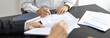 © Puwasit Inyavileart - Lawyer or judge has recommend a client sign a legal agreement in the courtroom, Legal Agreement Documents and Business Litigation Forms, scales of justice, law hammer, Litigation and legal services.