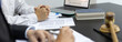 © Puwasit Inyavileart - Lawyers or judges sign documents in accordance with legal and fair terms of agreement, Legal Ethics and Integrity, scales of justice, law hammer, Litigation and legal services.
