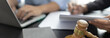 © Puwasit Inyavileart - Lawyers or judges sign documents in accordance with legal and fair terms of agreement, Legal Ethics and Integrity, scales of justice, law hammer, Litigation and legal services.