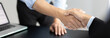 © Puwasit Inyavileart - Businessman shaking hands with a lawyer or judge After signing the contract and the agreement is complete, Approval of an agreement between business and law, End of the legal case.