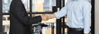 © Puwasit Inyavileart - Businessman shaking hands with a lawyer or judge After signing the contract and the agreement is complete, Approval of an agreement between business and law, End of the legal case.