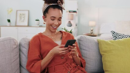 Wall Mural - Phone, social media and contact with a woman typing while sitting on her sofa to relax alone in her home. Living room, internet and mobile with a young female laughing while reading a text or meme