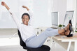 © Tamline L/peopleimages.com - Happy, freedom celebrate and black business woman after a office work day feeling happiness. Success, free and proud mindset celebrating career, job and staff working computer project finished