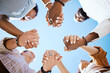 Diversity, support and people holding hands in trust and unity for community against sky background. Hand of diverse group in solidarity for united team building collaboration and teamwork success