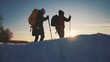 © maxximmm - nordic walking in winter. winter hike group of tourists silhouette. teamwork travel. two hikers with sticks walk in the winter in the snow at silhouette. activities sunset in winter happy family