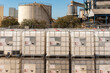 © M. Perfectti - IBC containers stored empty without cleaning after being used with corrosive liquids, cataloged as dangerous goods in the ADR.