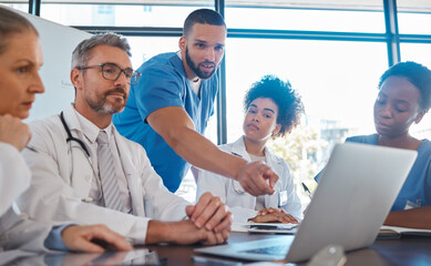 Medical, meeting and laptop for team in office in discussion, brainstorming and planning. Doctor, nurse and computer on desk show diversity in collaboration, teamwork or workshop for data analytics