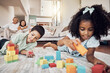 © Clement Coetzee/peopleimages.com - Kids, building blocks and creative learning in family home, living room floor and ground for growth, development and fun. Focus children, educational brick toys and youth creativity in lounge house