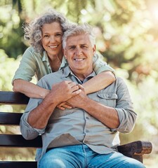 Wall Mural - Love, portrait and elderly couple hug and bonding in a park, happy and relax in nature together. Retirement, care and senior man and woman enjoying relationship and relaxing lifestyle with affection