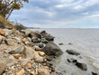 Rocky section of the shore of Lake Khanka in autumn. Russia, Primorsky Krai