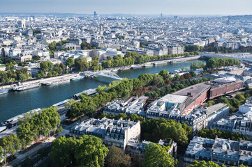 Wall Mural - Panoramic view from second floor of Eiffel tower in Paris. View of the buildings, parks with Debilly foot bridge over river Siene