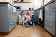 © N Lawrenson/peopleimages.com - Coffee, morning communication and senior couple talking on the kitchen floor together in their house. Happy, calm and peace for elderly man and woman with tea drink and conversation during retirement
