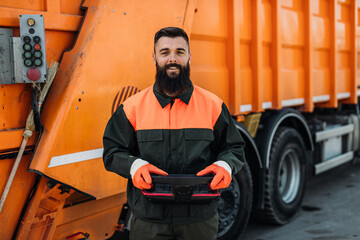 Sticker - Portrait of a young worker of the city utility company. Garbage collector.