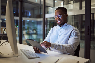 Fototapete - Businessman working on digital tablet late in office at night, happy and inspired by career goal. Motivation, management and vision by black entrepreneur excited by innovation and new company