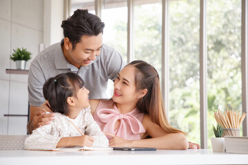 Wall Mural - Real estate and mortgage concept : Family with child having activity in new home. Joyful first-time buyers in living room. Real estate, residential mortgage, moving into dream house.