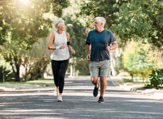 Wall Mural - Health, senior couple and running while talk and exercise for fitness, wellness and healthy together in nature. Retirement, man and woman enjoy workout, chatting and jog outside in park on sunny day