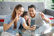 © aekkorn - Happy asian family taking selfie at home.Family,love and happiness concept.