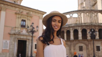 Wall Mural - Attractive elegant female walking on the streets in Valencia