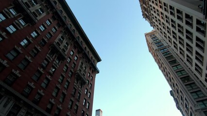 Wall Mural - Low angle of New York city buildings.