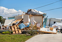 Severely Damaged House After Hurricane Ian In Florida Mobile Home Residential Area. Consequences Of Natural Disaster