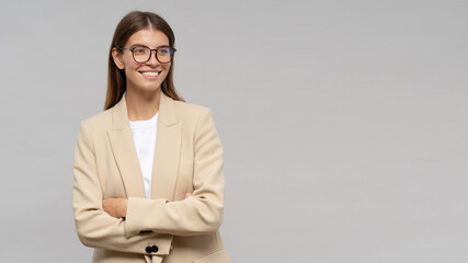 Wall Mural - Portrait of businesswoman with crossed hands on gray banner background with copy space