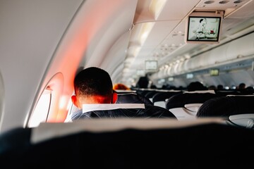 Closeup of a person sitting at the window in a airplane