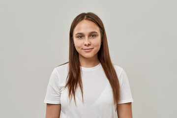 Wall Mural - Portrait of smiling female teenage look at camera