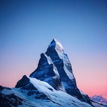 Majestic Matterhorn Peak At White Night Under Shooting Star. Snow Covered Mountain Summit Under Starry Sky Scenic View. World Wonder, Winter Tourism, Vacation And Adventure Concept