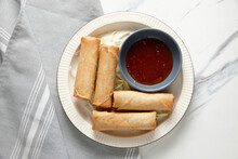 Top Shot Of Spring Rolls With Ketchup